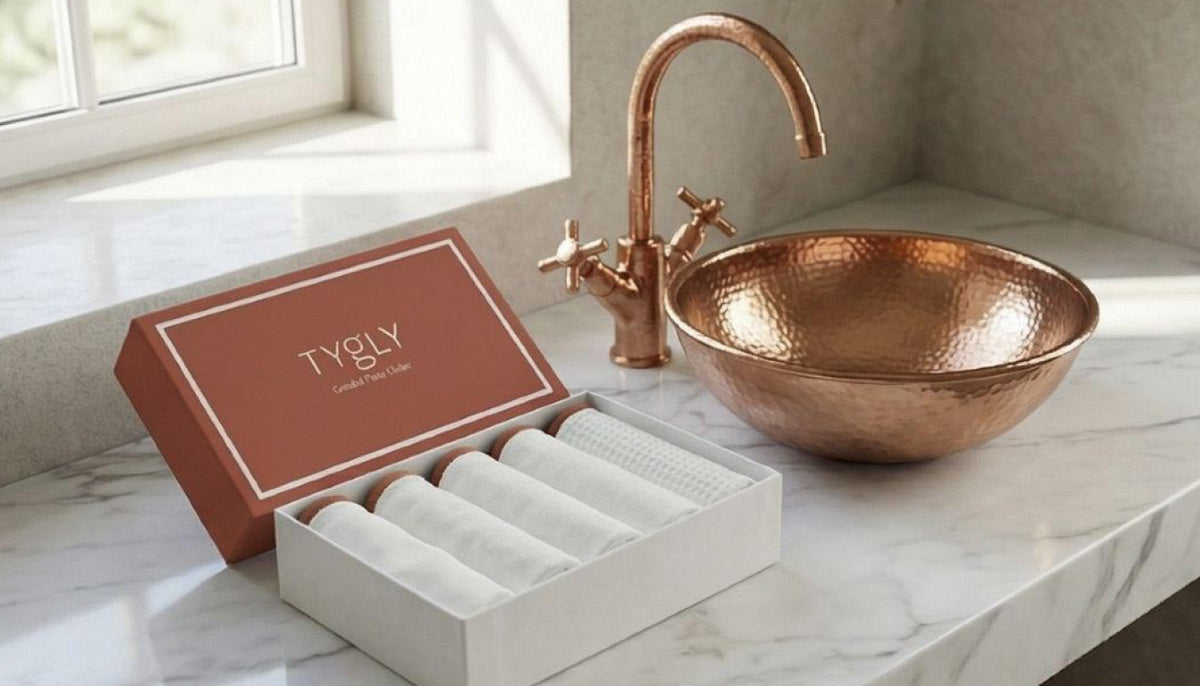 TYGLY Discovery Box with five graded face cloths displayed on luxury bathroom countertop